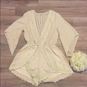 Cream romper in original packaging